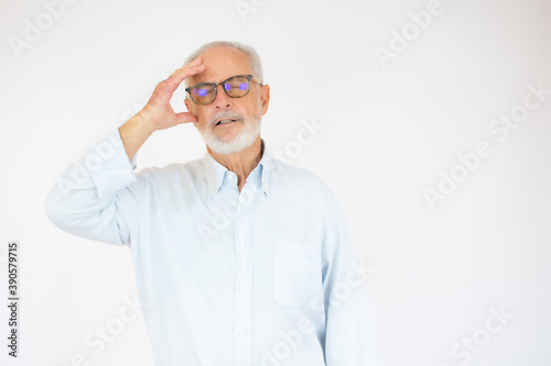 Handsome middle age senior man with grey hair over isolated white background Thinking worried about a question