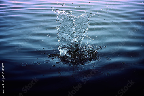 big water splash in the lake after dropping stones