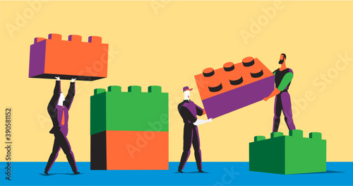 Persone che lavorano insieme per costruire una città fatta di mattoncini colorati