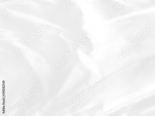 White grey fabric luxurious with a soft wave, abstract blurred background..