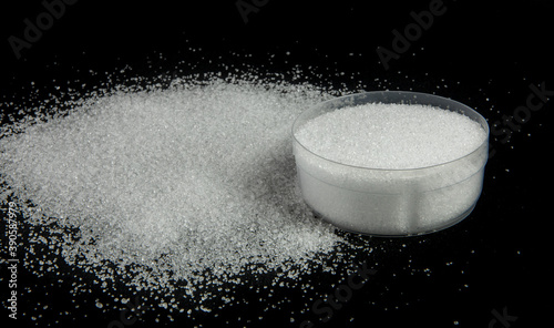Fotografie Citric acid or lemon acid powder from top view