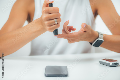 Blood Sugar Finger Prick Testing at Home for Diabetes photo