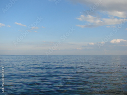 Panorama of the Black Sea coast in a windless evening at sunset. © Hennadii
