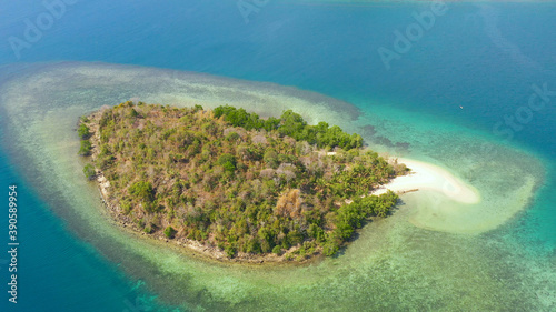 Tropical island with sandy beach on the Zamboanga Peninsula. Simoadang Island. Mindanao, Philippines.