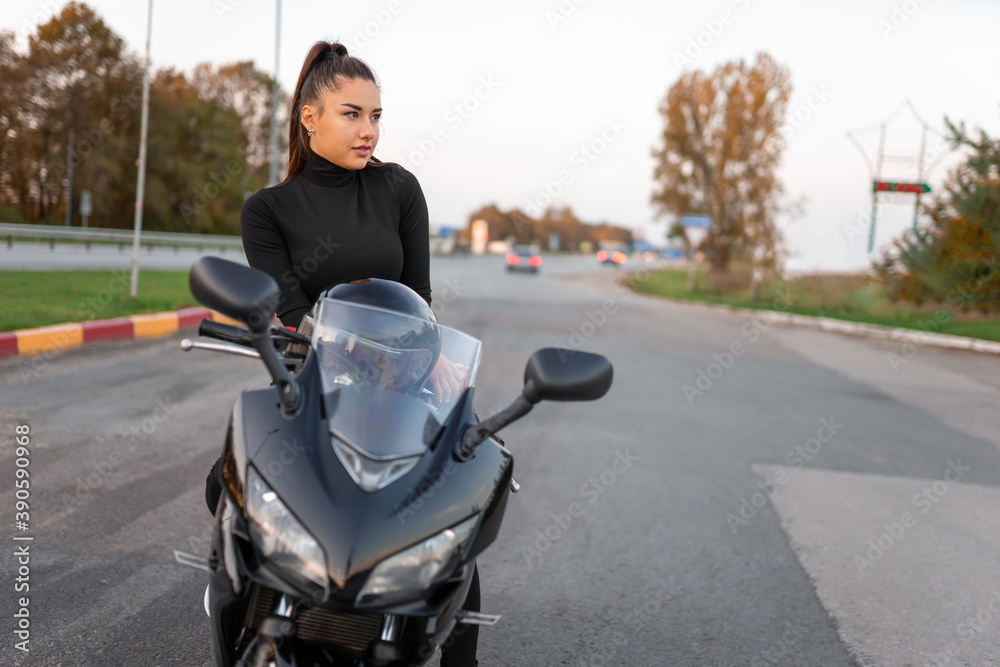 Stylish biker girl on motorcycle Stylish biker girl on motorcycle