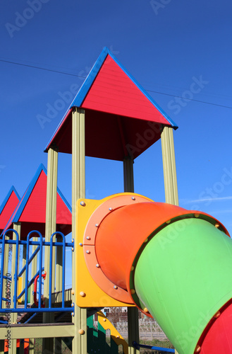 children's bright plastic slide with a pipe on the street in the Playground for entertainment