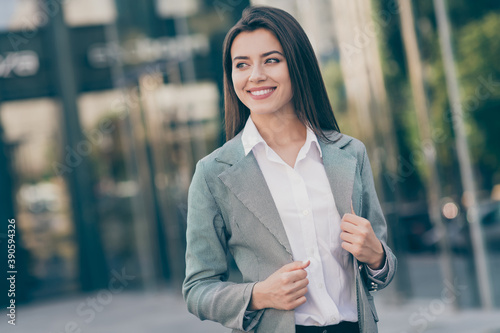 Vászonkép Photo of happy optimistic pretty young businesswoman wear formalwear outside bui
