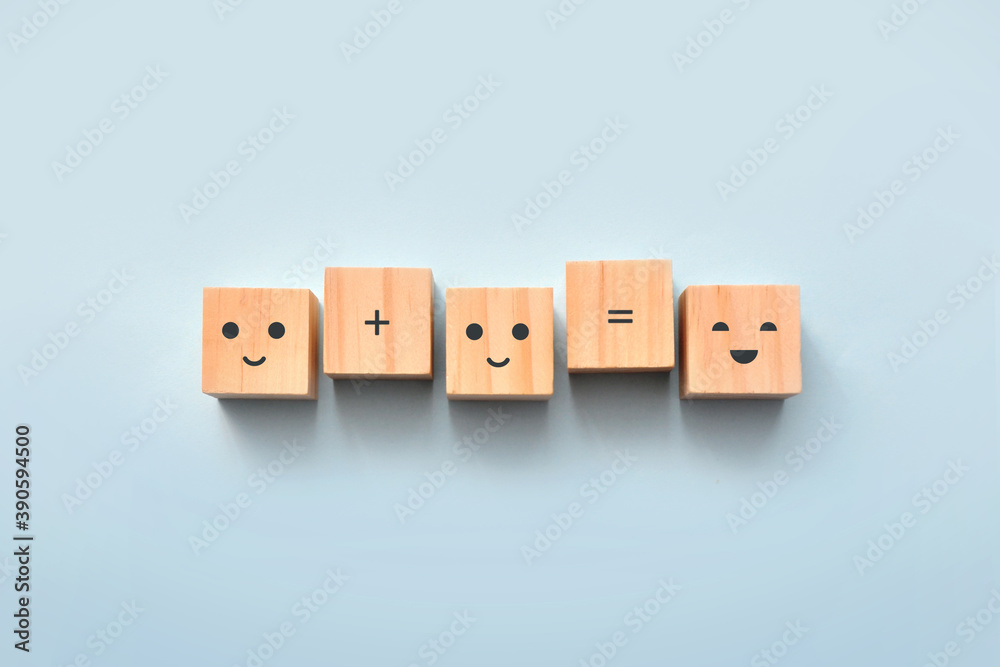Wooden cubes with smiling faces. Two happy people create happiness
Wooden cubes with smiling faces. Two happy people create happiness