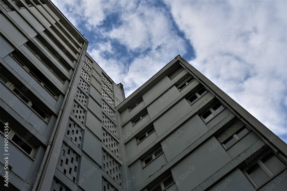 Sad grey apartment tower with blue sky Sad grey apartment tower with blue sky