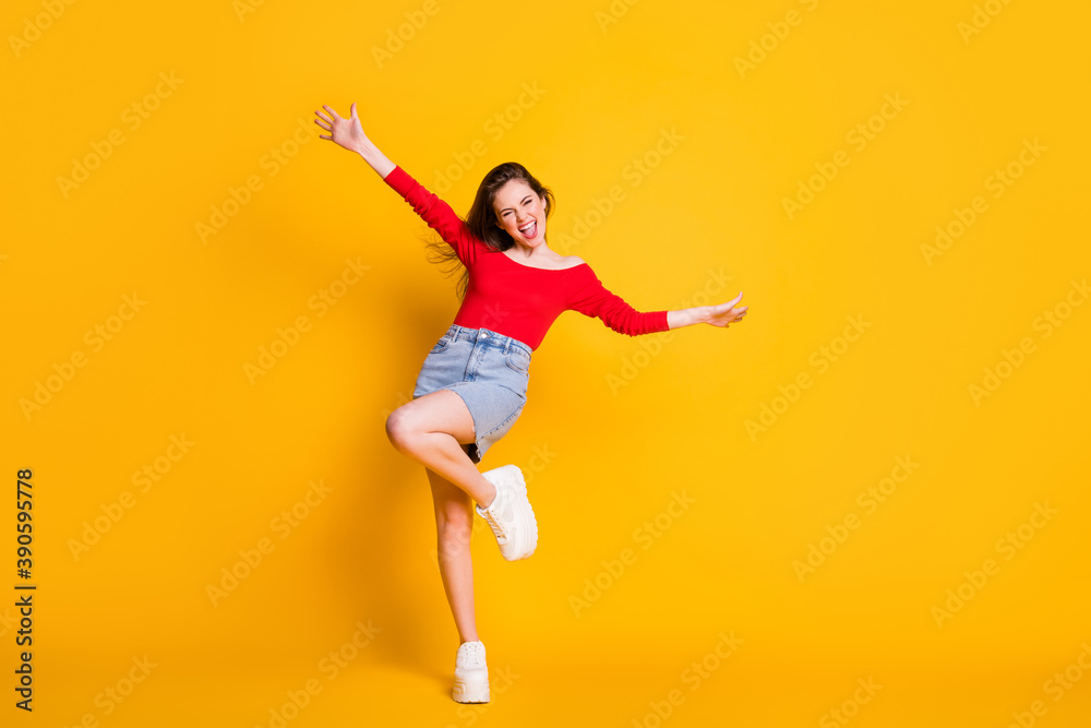 Full length body photo portrait of oretty crazy cheerful lovely nice glad positive optimistic lady having fun time isolated over bright color yellow background