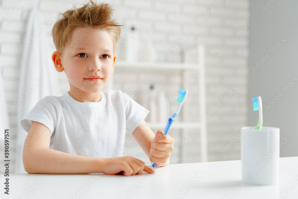 Little boy holding toothbrush in his hand Little boy holding toothbrush in his hand