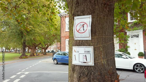 Sign on a tree from a British neighbourhood, that prohibits urinate in public