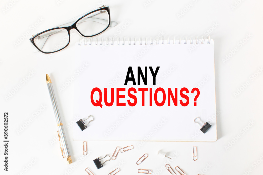 text ANY QUESTIONS in a magnifying glass, office concept, business concept, Finance text ANY QUESTIONS in a magnifying glass, office concept, business concept, Finance