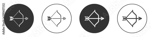 Black Medieval bow and arrow icon isolated on white background. Medieval weapon. Circle button. Vector.