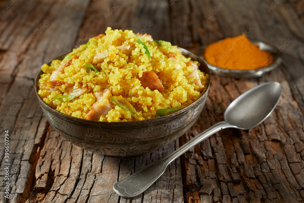 Bowl of couscous and quinoa colored with saffron Bowl of couscous and quinoa colored with saffron