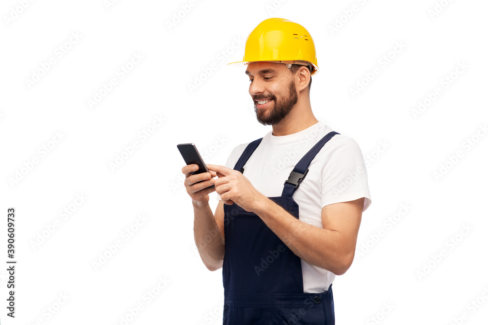 profession, construction and building - happy smiling male worker or builder in yellow helmet and overall with smartphone over white background profession, construction and building - happy smiling male worker or builder in yellow helmet and overall with smartphone over white background