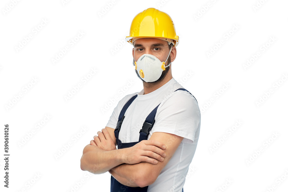 profession, construction and building - male worker or builder in yellow helmet and respirator with crossed arms over white background profession, construction and building - male worker or builder in yellow helmet and respirator with crossed arms over white background