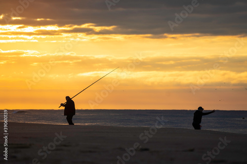 man fishing at sea in morning