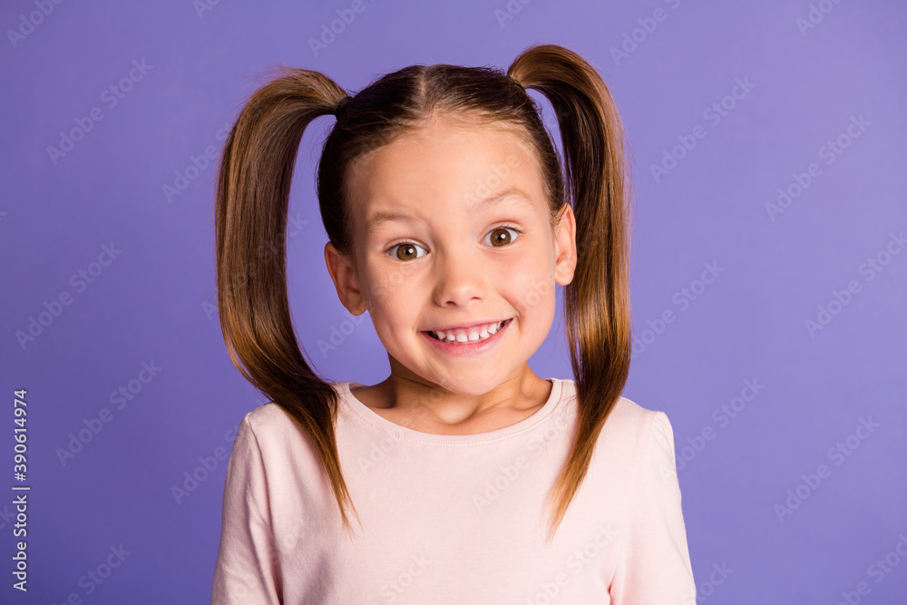 Photo of happy cheerful little girl wear sweatshirt excited smile isolated on violet purple color background Photo of happy cheerful little girl wear sweatshirt excited smile isolated on violet purple color background