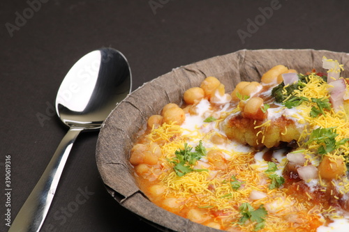 Ragda pattice -Aloo tikki or Potato Cutlet or Patties is a popular Indian street food made with boiled potatoes, spices and herbs served with tamrind chutney and peas curry. photo