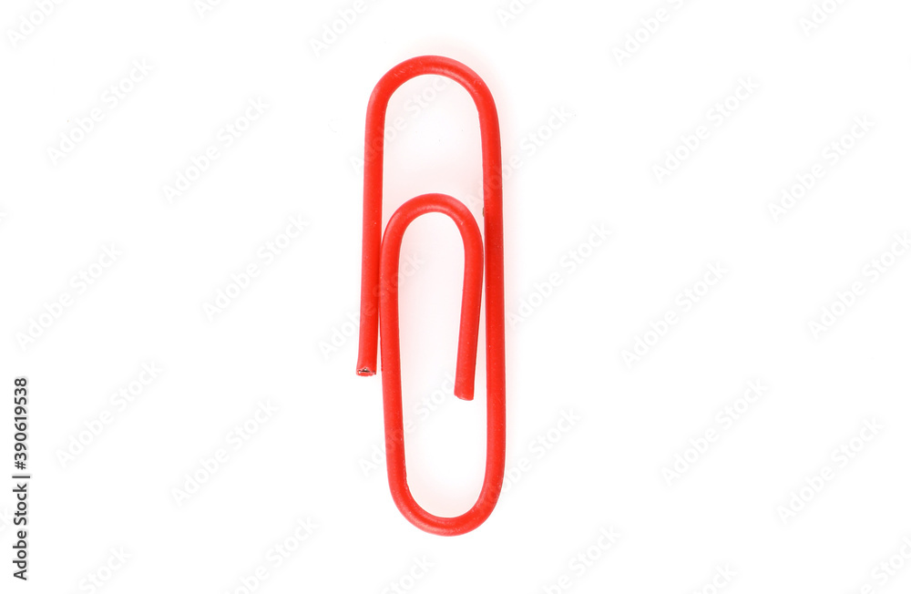 Single red paper clip isolated on white background. Top view. Copy space. Single red paper clip isolated on white background. Top view. Copy space.
