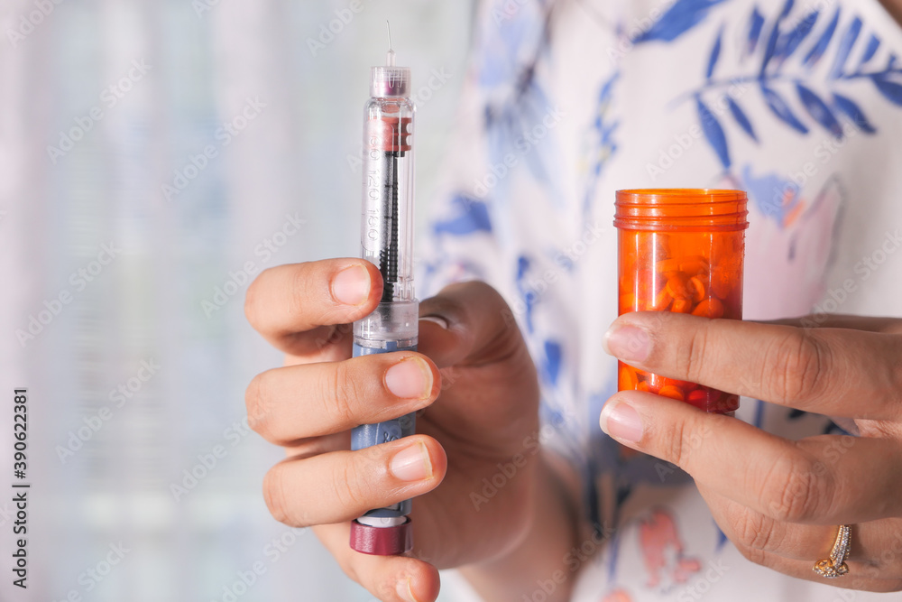 hand holding Insulin pens with copy space close up hand holding Insulin pens with copy space close up