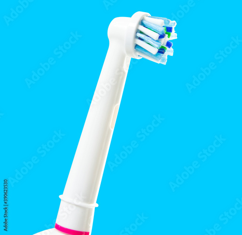 Electronic toothbrush isolated on blue background