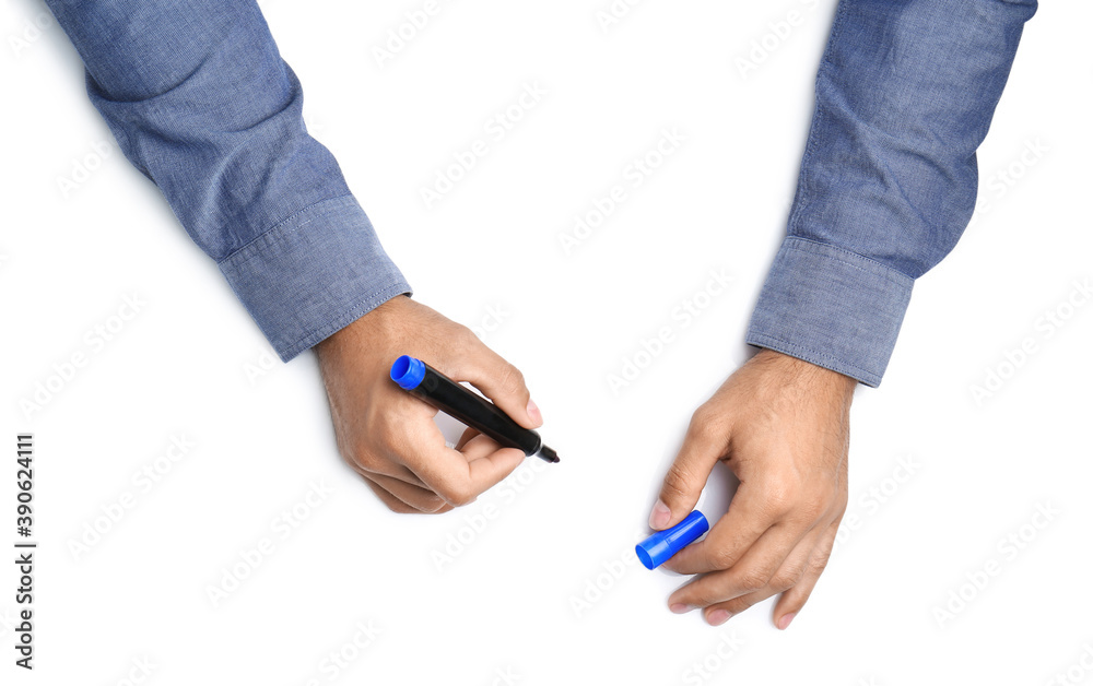 Man with marker on white background, top view. Closeup of hands