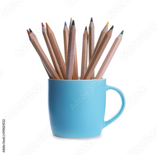 Colorful pencils in light blue cup on white background