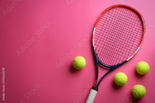 Tennis racket and balls on pink background, flat lay. Space for text