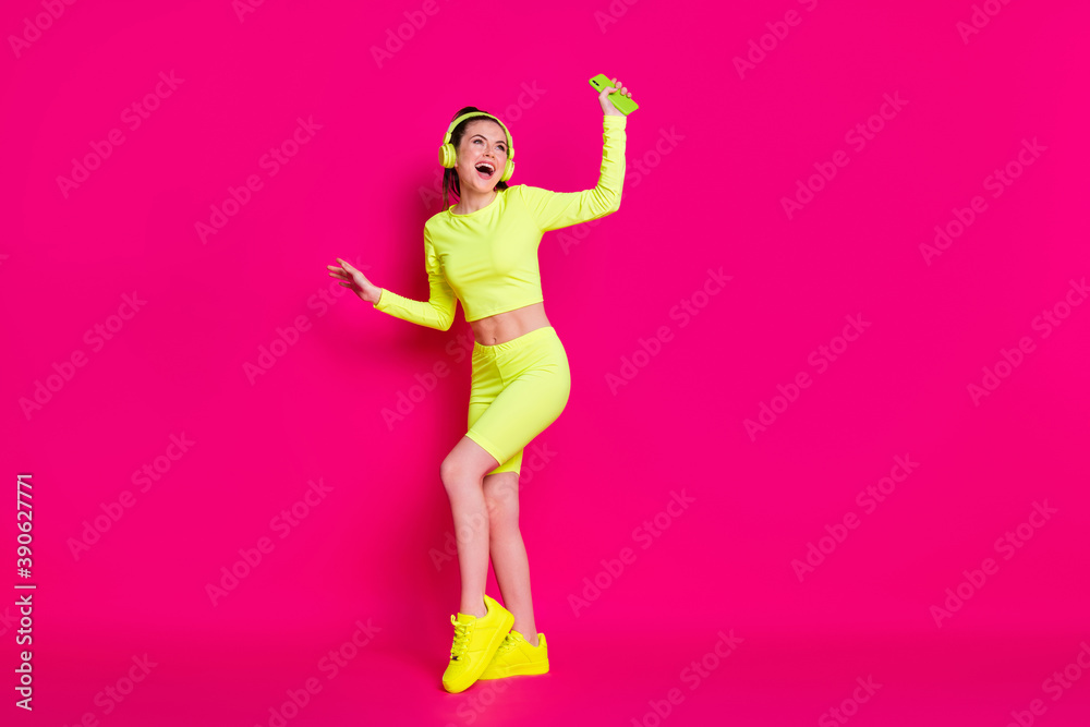 Full length body size view of her she nice attractive slender cheerful glad girl listening different music dancing having fun rest isolated bright vivid shine vibrant pink fuchsia color background