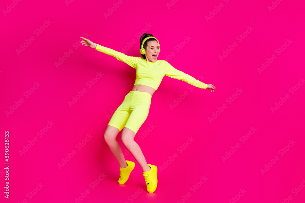 Full length body size view of her she nice attractive fit slim sporty funky cheery girl listening music dancing having fun fooling isolated bright vivid shine vibrant pink fuchsia color background
