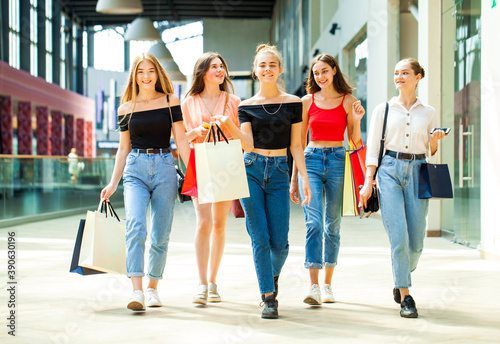 Wallpaper Mural Five happy young women are walking in the mall Torontodigital.ca