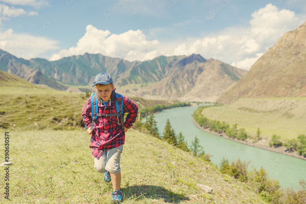 boy hiking in the mountains