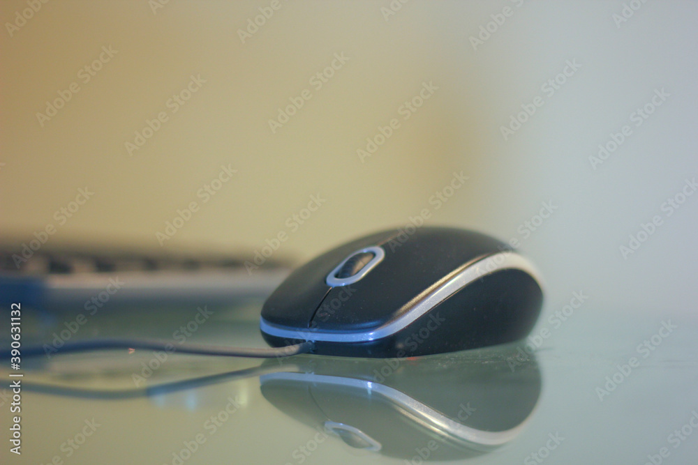 Black color computer mouse on table Black color computer mouse on table