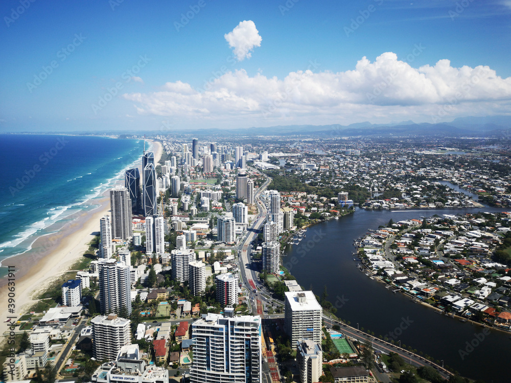 Surfers Paradise is a suburb within the local government area of Gold Coast in Queensland, Australia - aerial view of the coastline with high rise hotels overlooking the beach.