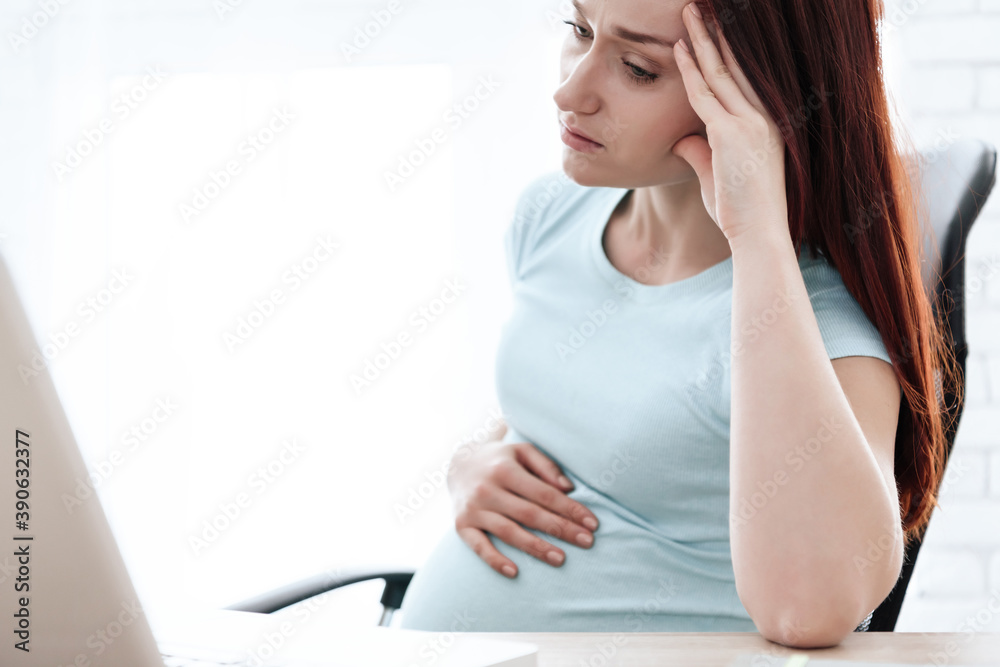 Naklejka premium Girl put hand on pregnant belly and sore head.