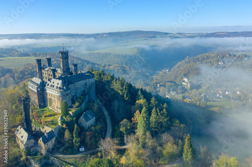 Bird's eye view of Schaumburg Castle near Balduinstein / Germany in autumn with fog