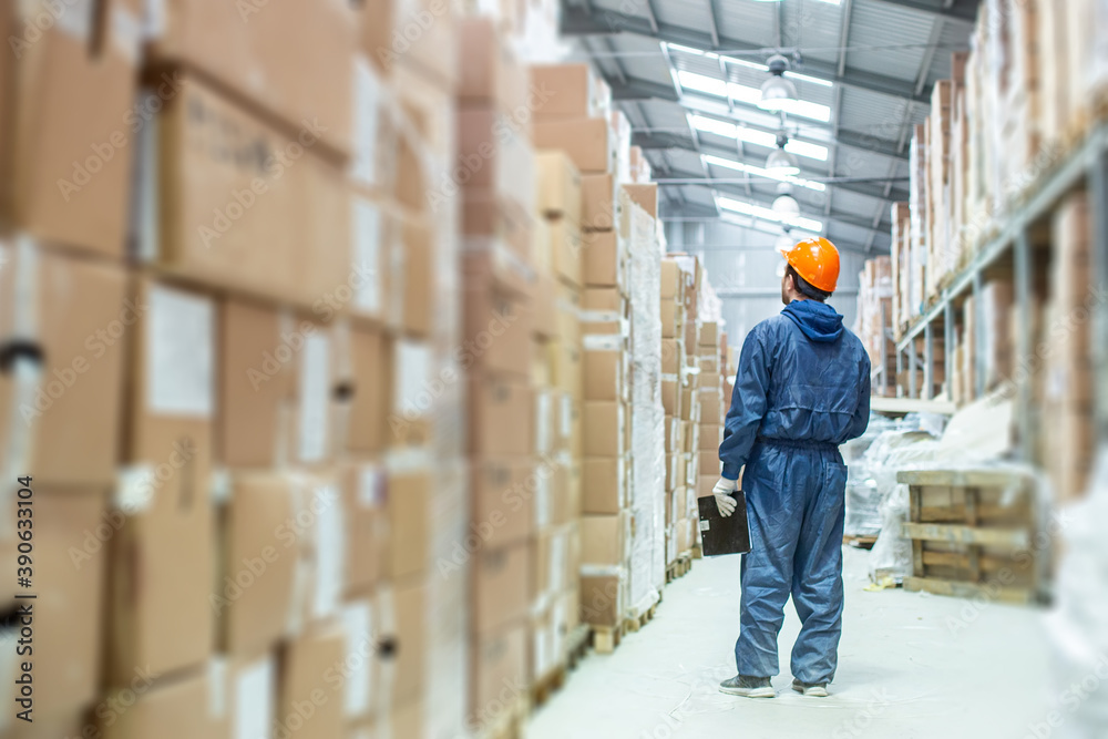 worker in a helmet in a warehouse worker in a helmet in a warehouse
