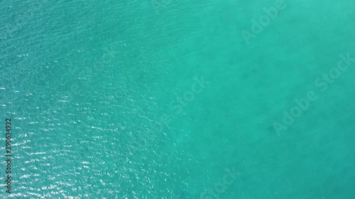 Wallpaper Mural Drone fly over a serene turquoise blue ocean on summer day. Torontodigital.ca