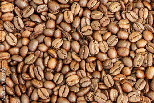 Texture of roasted arabica coffee beans.