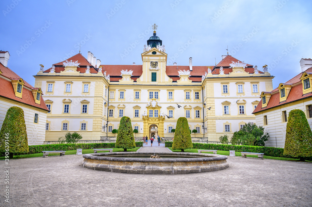 View of small water fountain and front facade of Valtice castle, UNESCO (Czech Republic)