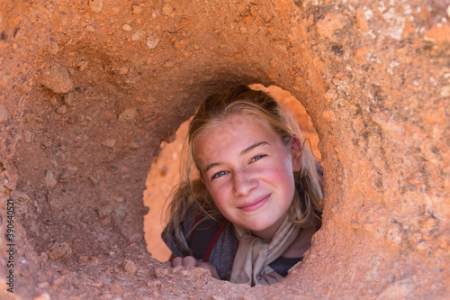 12 year old girl hiking in Tsankawi Runis, New Mexico. photo