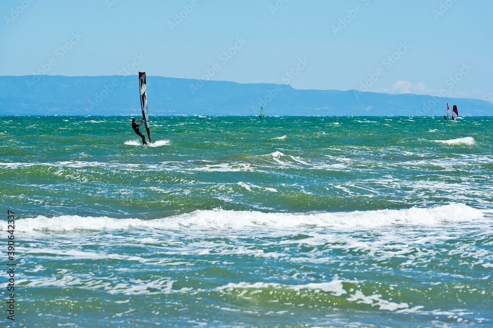 Kite surfing and windsurfing off Riumar beach, near Deltebre, Parc Natural del Delta de l'Ebre, Castellón, Eastern Spain Kite surfing and windsurfing off Riumar beach, near Deltebre, Parc Natural del Delta de l'Ebre, Castellón, Eastern Spain