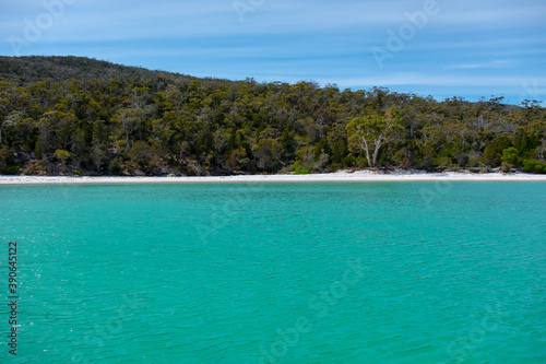 View of the coast of the Freycinet Peninsula, Tasmania from a boat on a sunny day © Mark Hunter