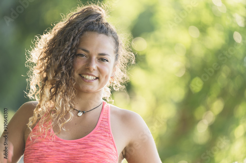 girl or woman doing sports outdoors near a river, nature