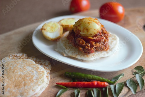 Rice pancake and egg roast, a traditional rice based breakfast dish of Kerala photo