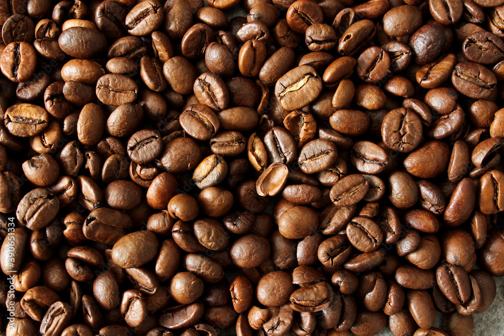 Roasted coffee beans close up photo. Natural pattern. 