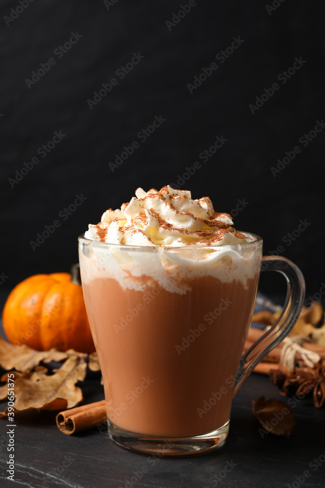 Delicious pumpkin latte on black slate table, closeup Delicious pumpkin latte on black slate table, closeup