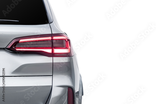 The back of a silver expensive crossover car:  bumper, trunk lid, taillight on the back white background. Mock up for the advertising industry. New car concept